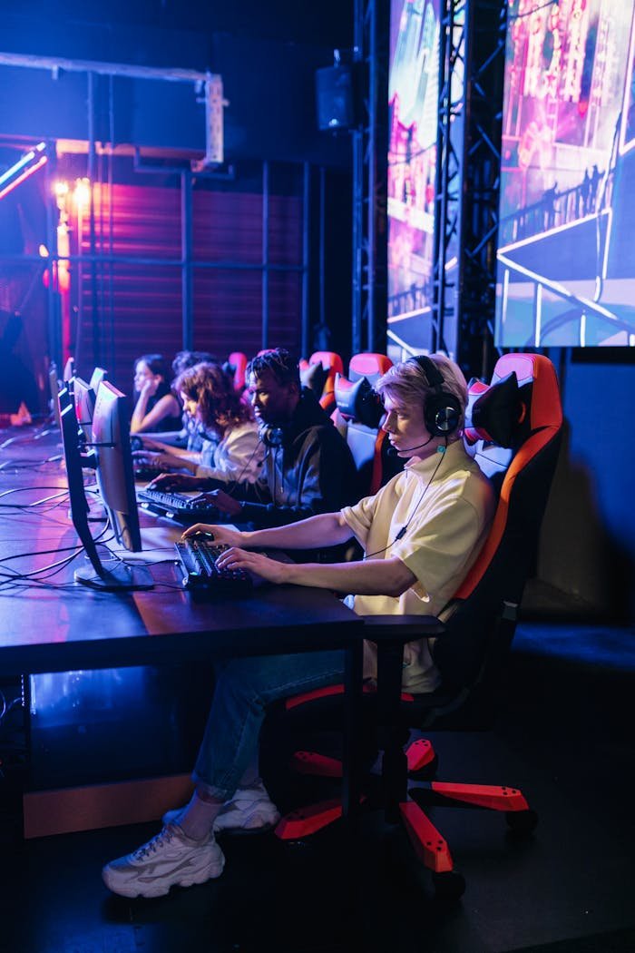 A team of gamers immersed in an e-sports competition, showcasing teamwork and focus.